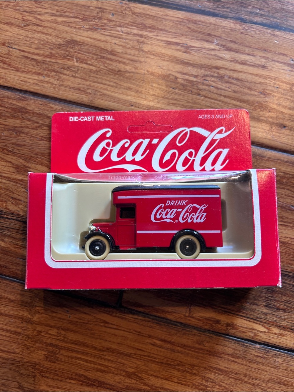 Vintage Coca-Cola die cast metal vehicle. “Drink Coca Cola”.